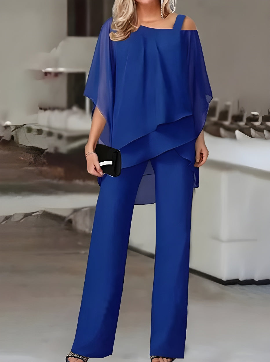 Luxuriöses, asymmetrisches Set aus schulterfreier Bluse und Hose 